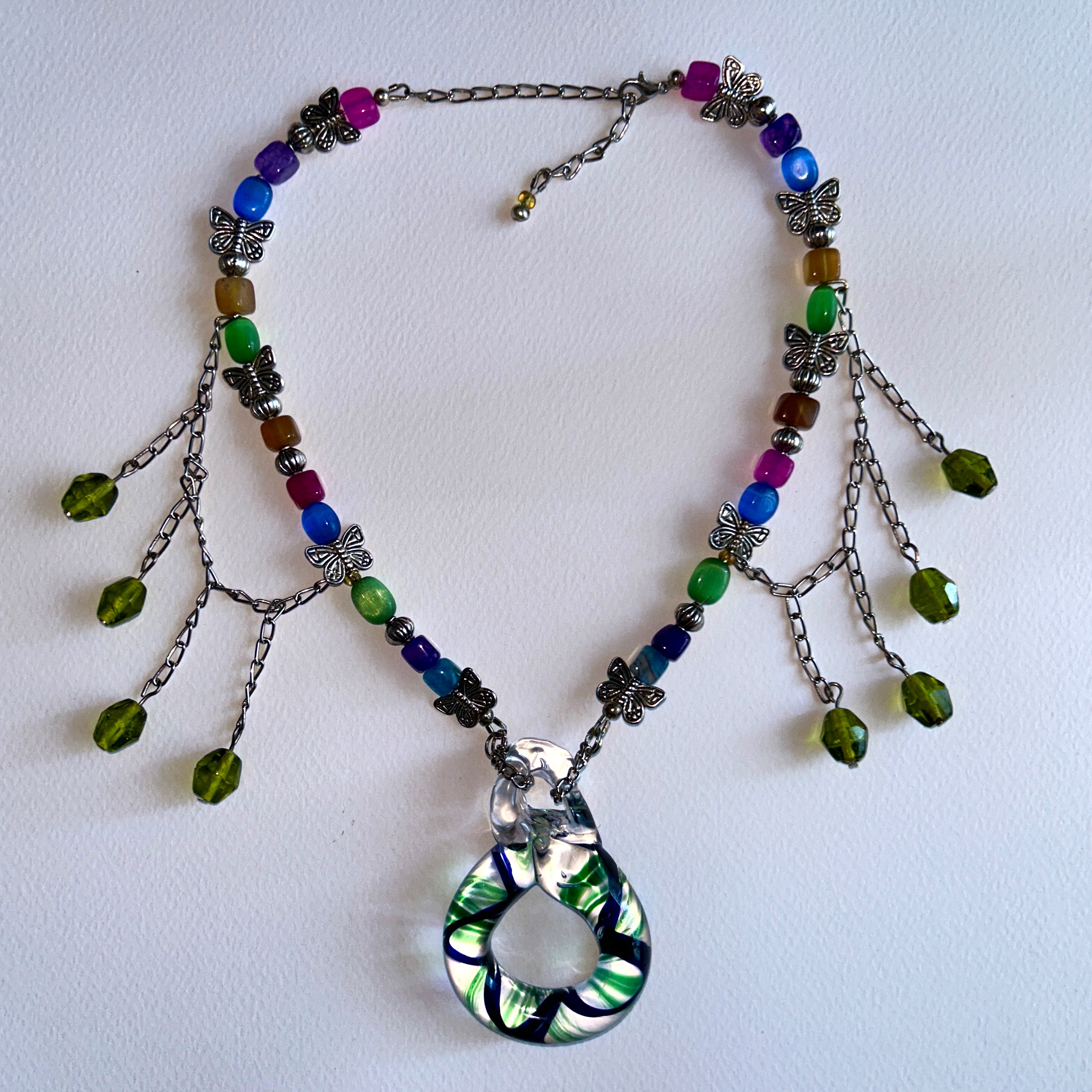 beaded necklace with handmade blue, green and transparent glass loop pendant